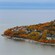 Buildings and trees near a shoreline
